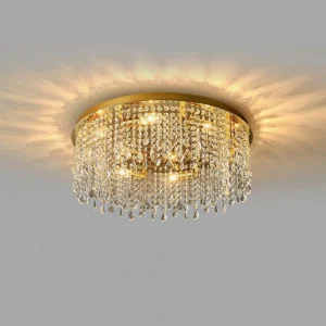 Elegant crystal ceiling chandelier installed on white ceiling with warm LED illumination creating ambient glow