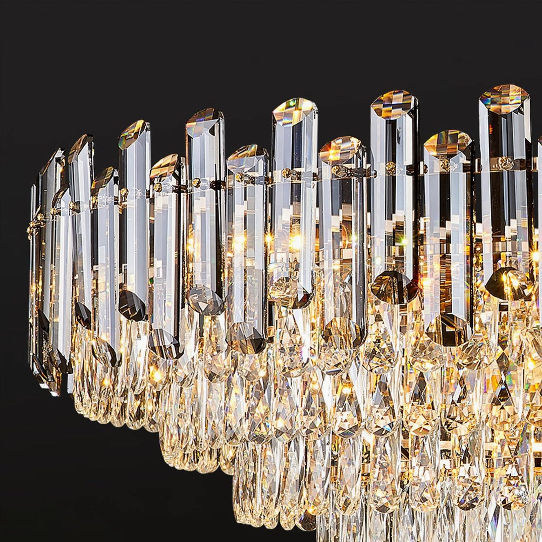 Close-up detail of tiered crystal chandelier showing vertical crystal bars and suspended droplet pendants