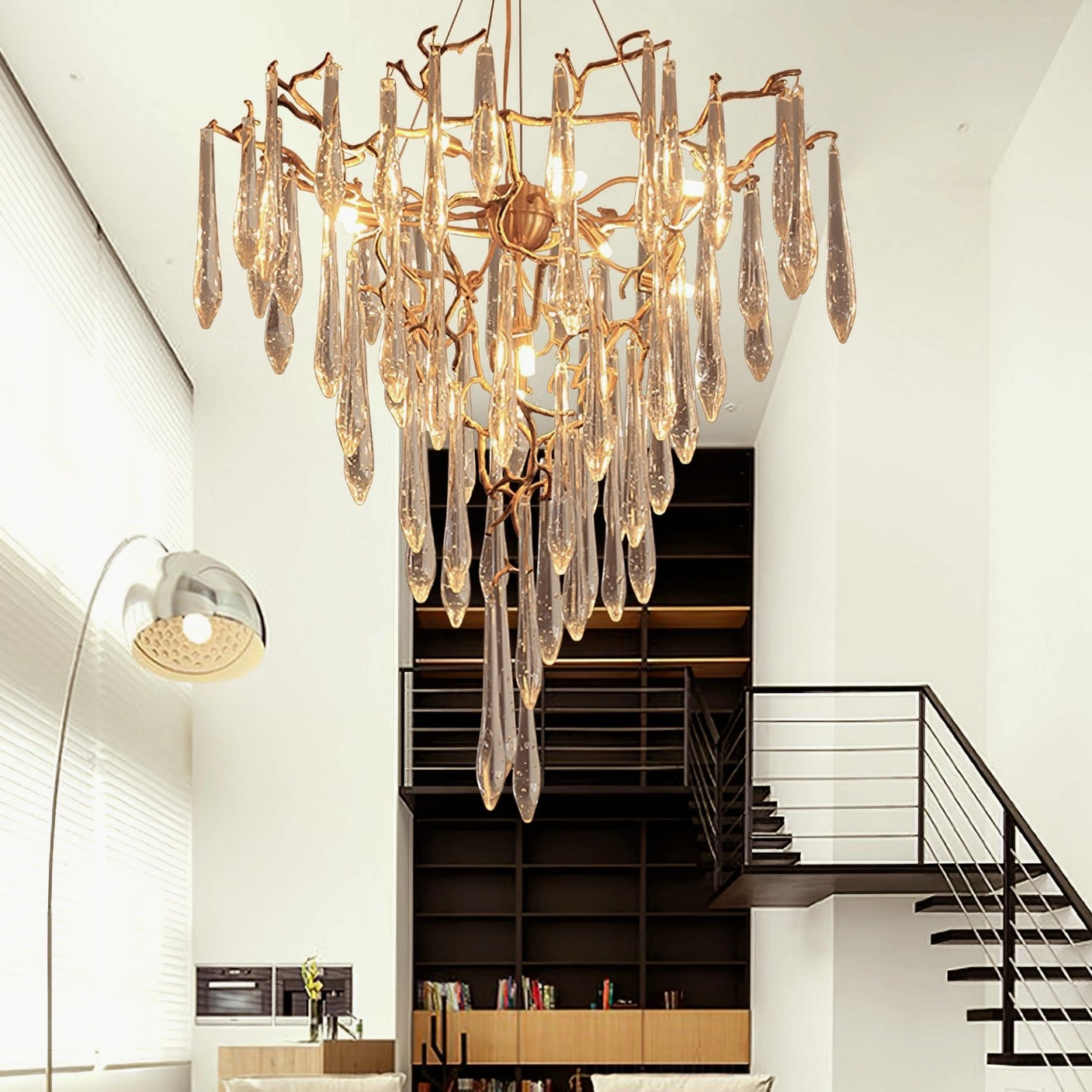 Crystal chandelier overhead view polished brass frame teardrop crystal pendant geometric design