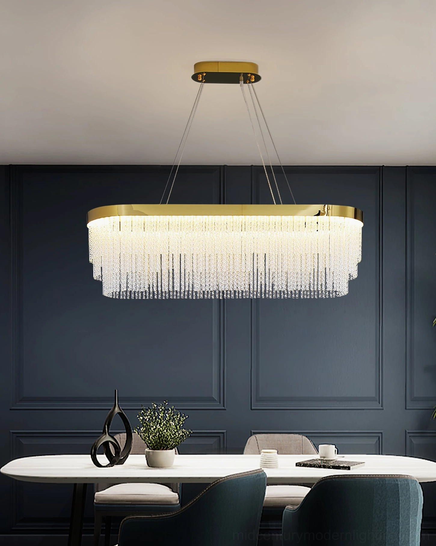 Multiple crystal chandeliers installed at different heights contemporary home lighting design