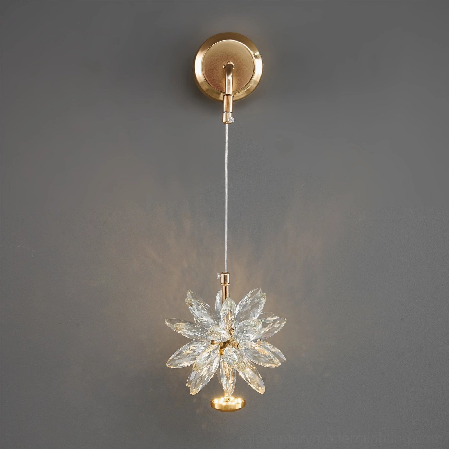 Crystal flower wall lamp mounted fixture showing rear installation view and mounting hardware on gray interior wall