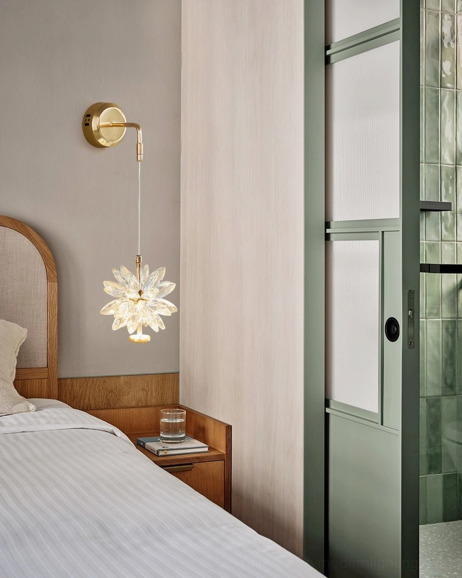 Crystal flower wall sconce in modern minimalist bedroom setting, paired with contemporary bed and glass doors, creating ambient bedroom lighting