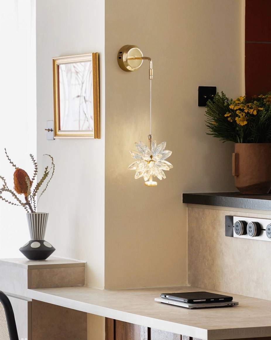 Crystal flower wall lamp providing warm decorative lighting in contemporary home workspace above desk area with neutral interior decor
