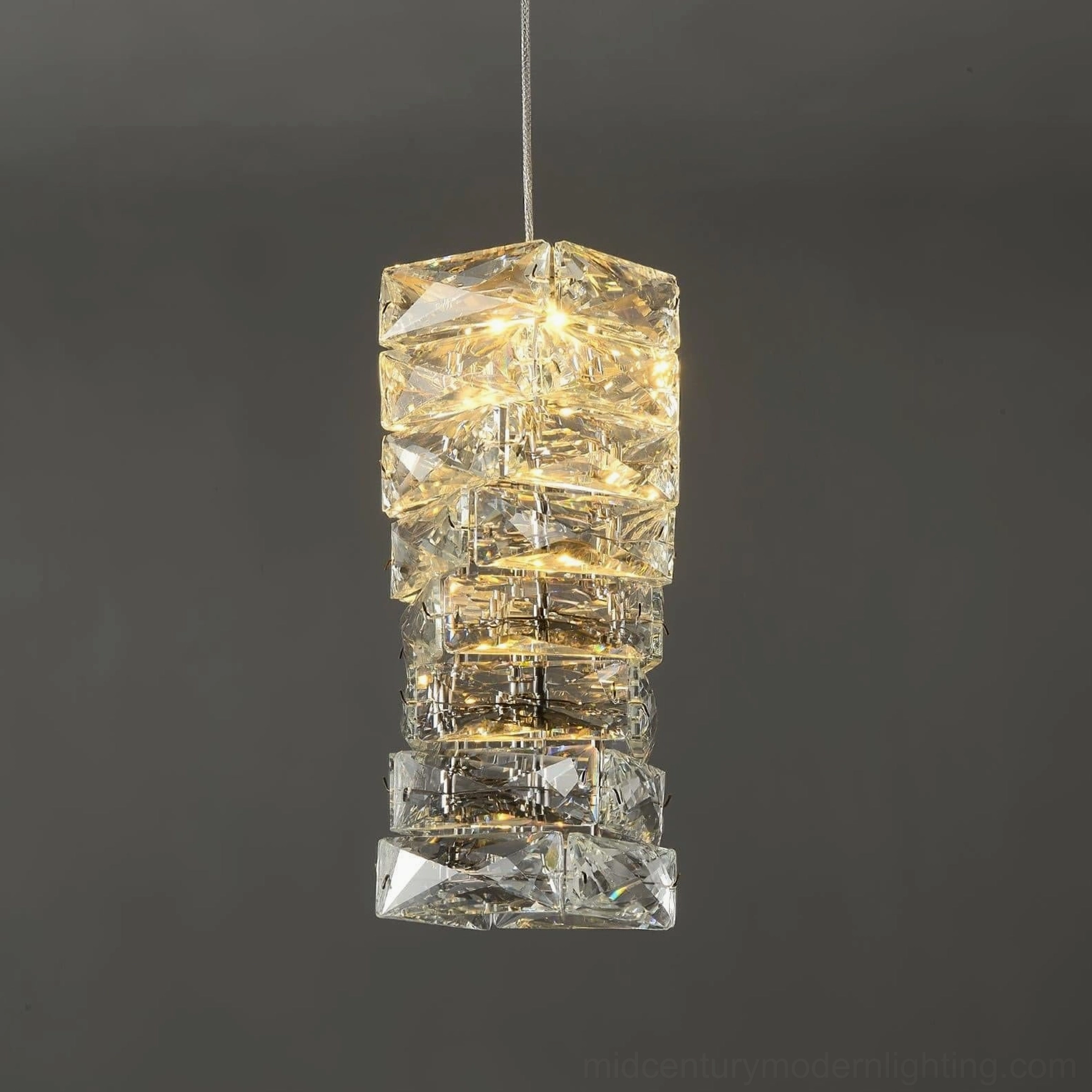 Crystal pendant lamp in contemporary interior demonstrating faceted crystal shade and ceiling mount installation