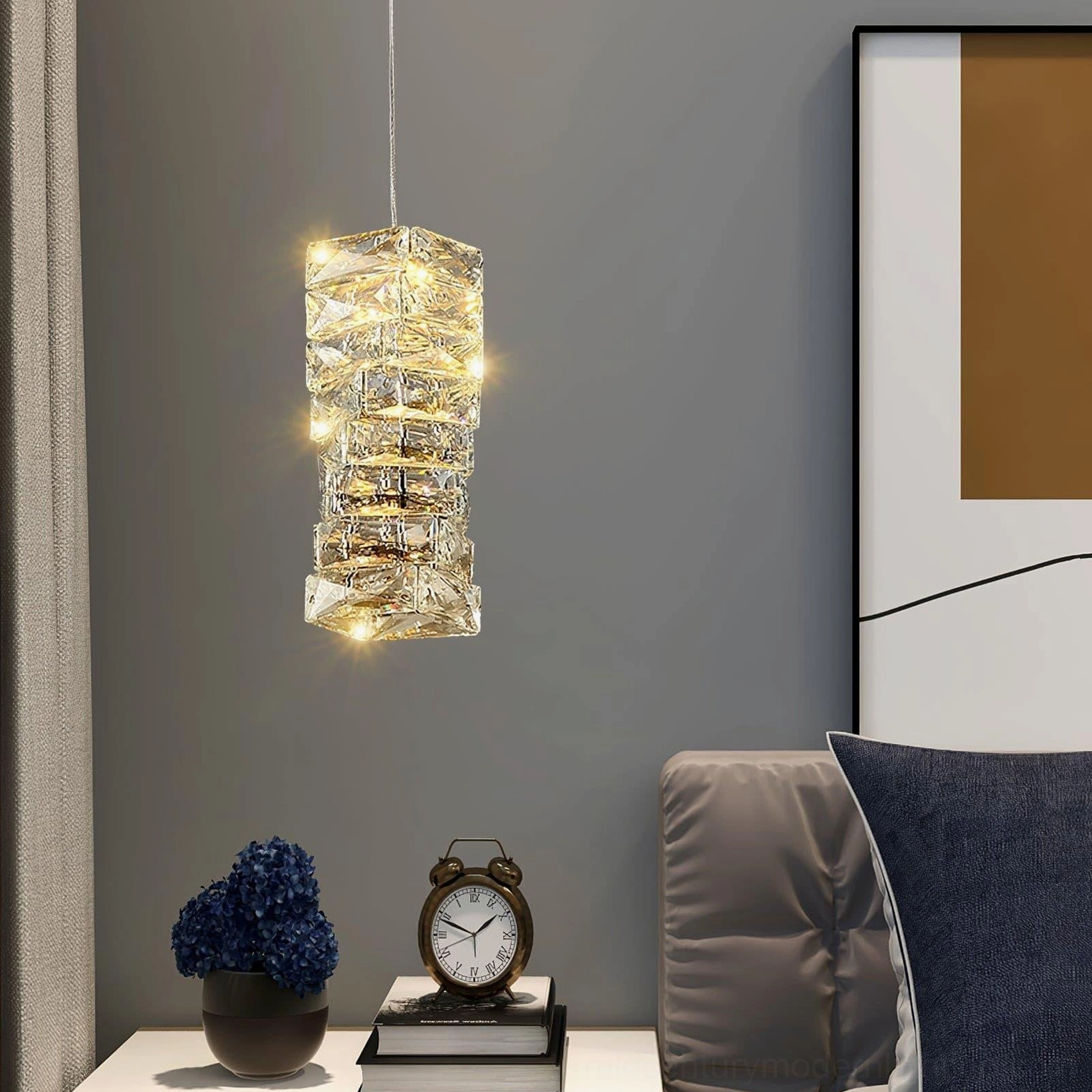 Single faceted crystal pendant lamp suspended above modern console table in living room with coordinated home decor