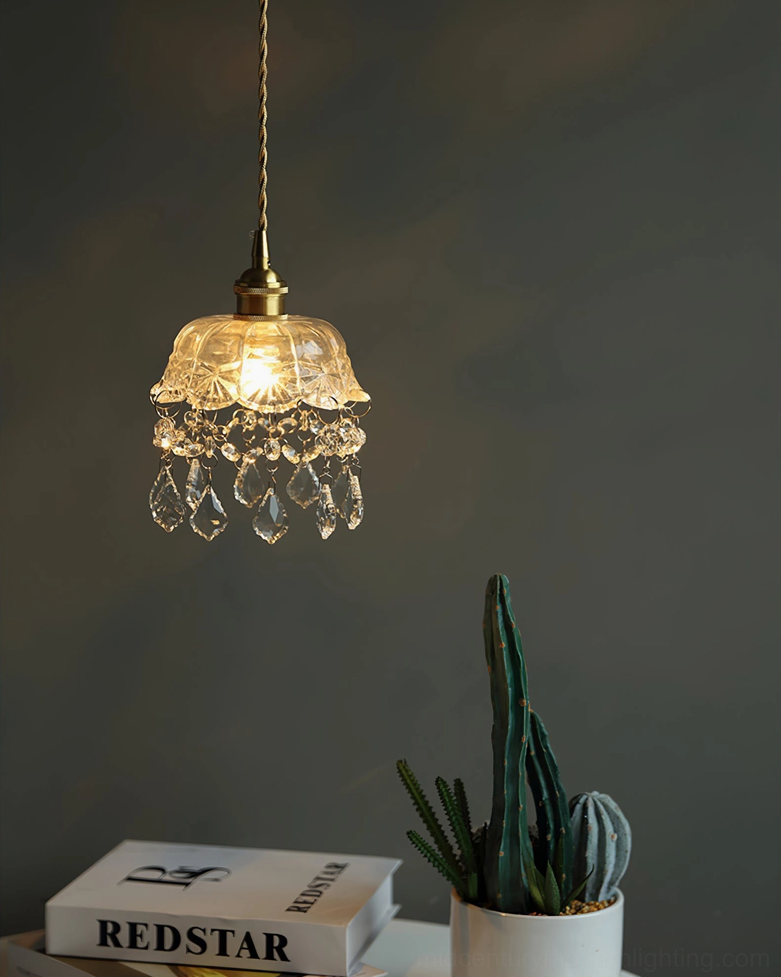 Crystal glass jewel pendant light fixture, detailed view of pressed glass texture and brass mount
