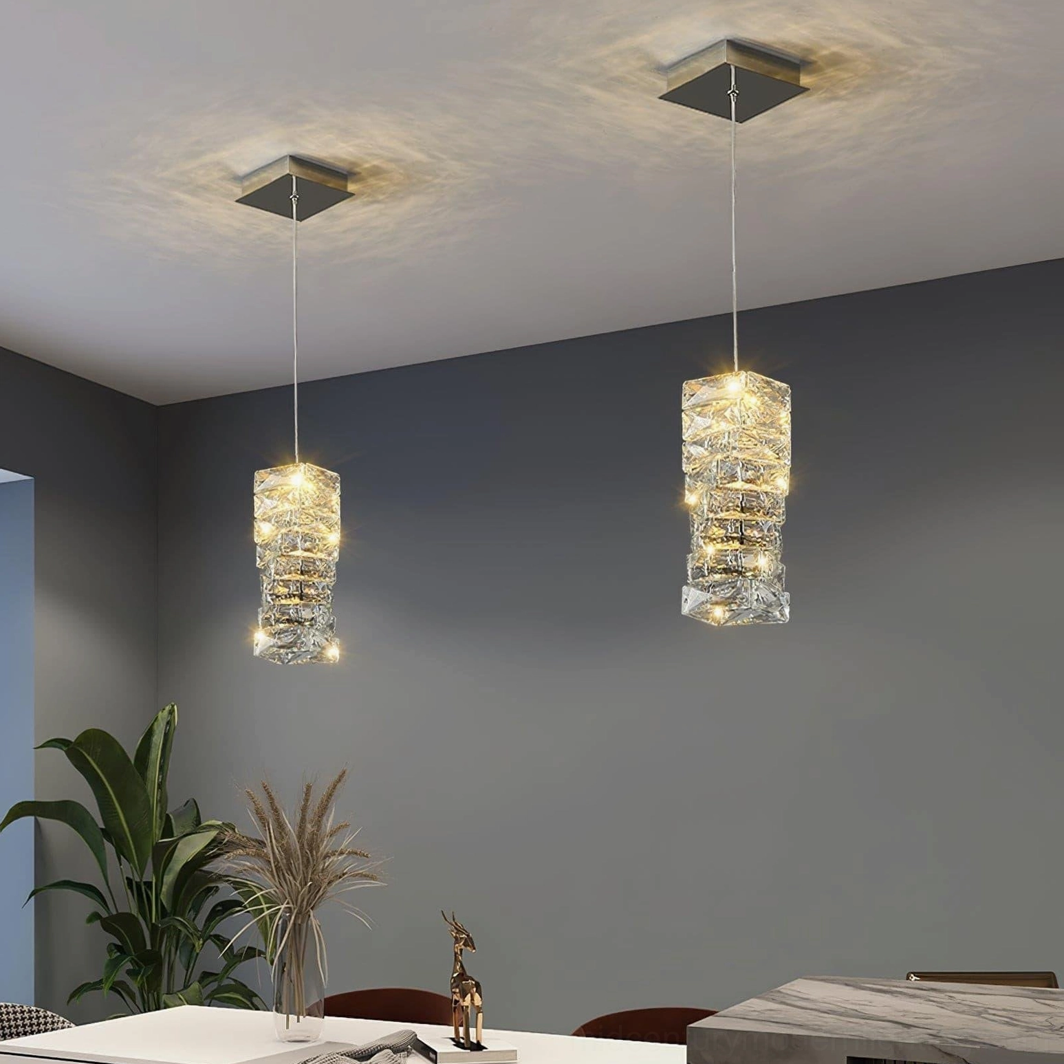 Faceted crystal pendant lamp detail shot showing geometric crystal construction and light-diffusing properties