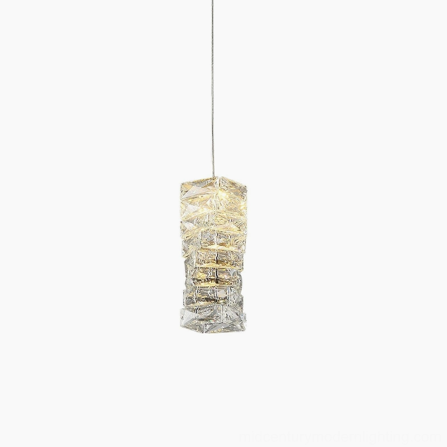 Faceted crystal pendant fixture installed in contemporary interior with focus on geometric design and warm illumination