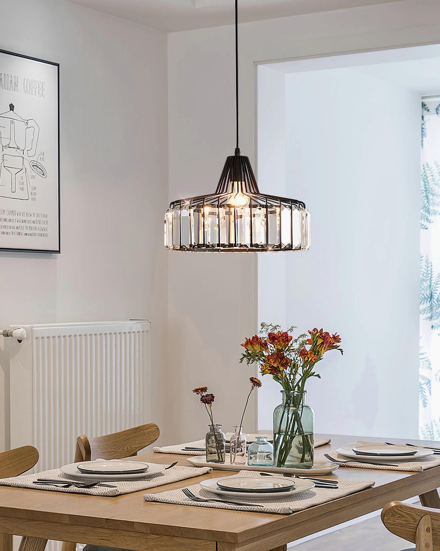 Crystal pendant lamp with black frame and clear K9 crystals in bright modern dining room