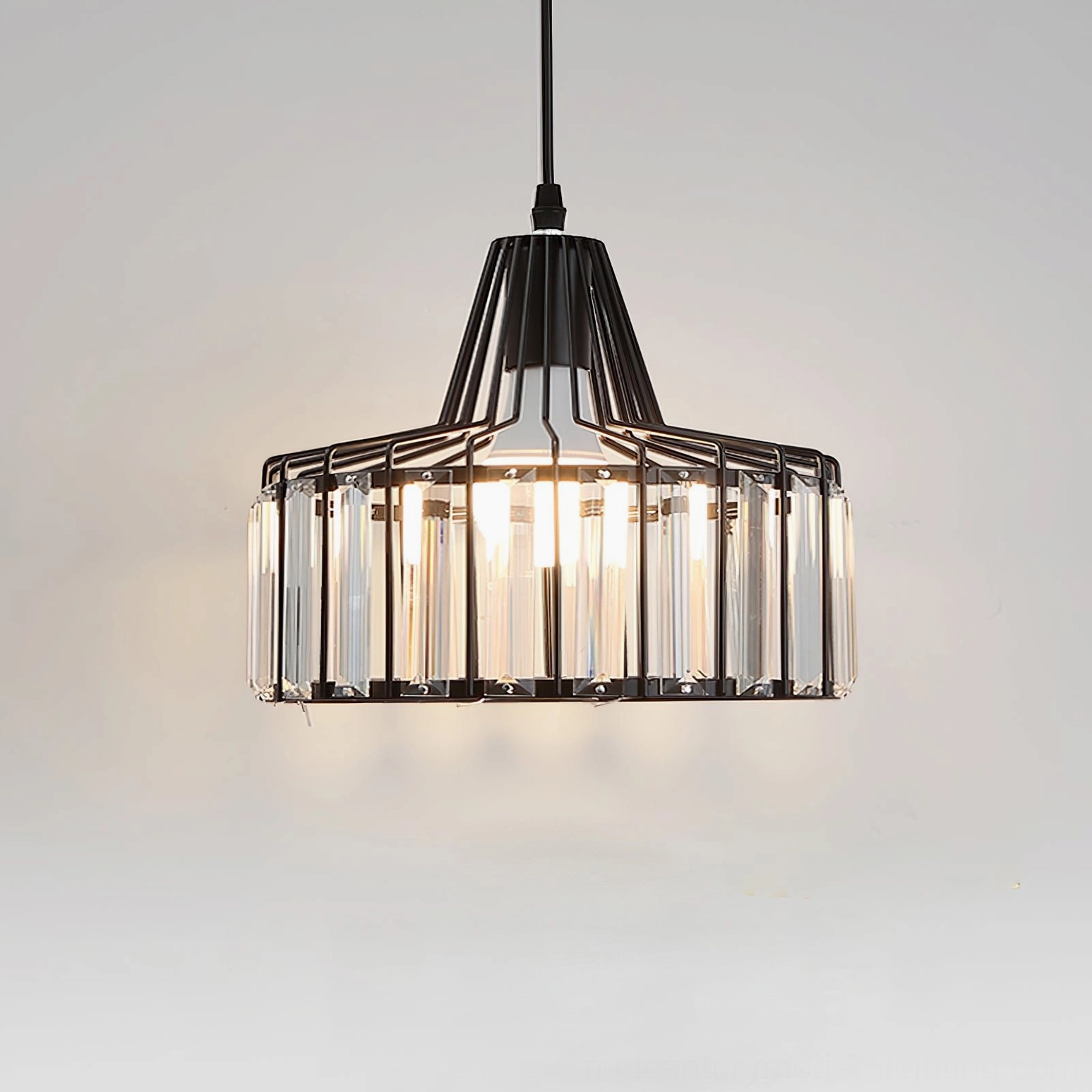 Crystal cage pendant light showing hanging wire and suspension system detail