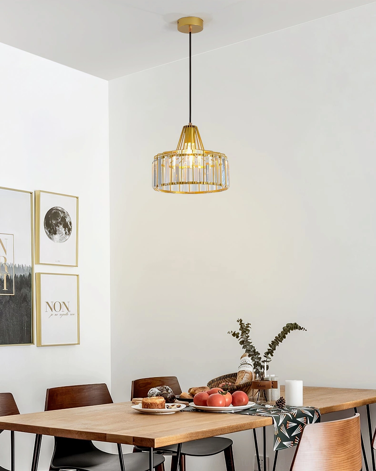 Modern crystal pendant lamp above dining area demonstrating proper installation height