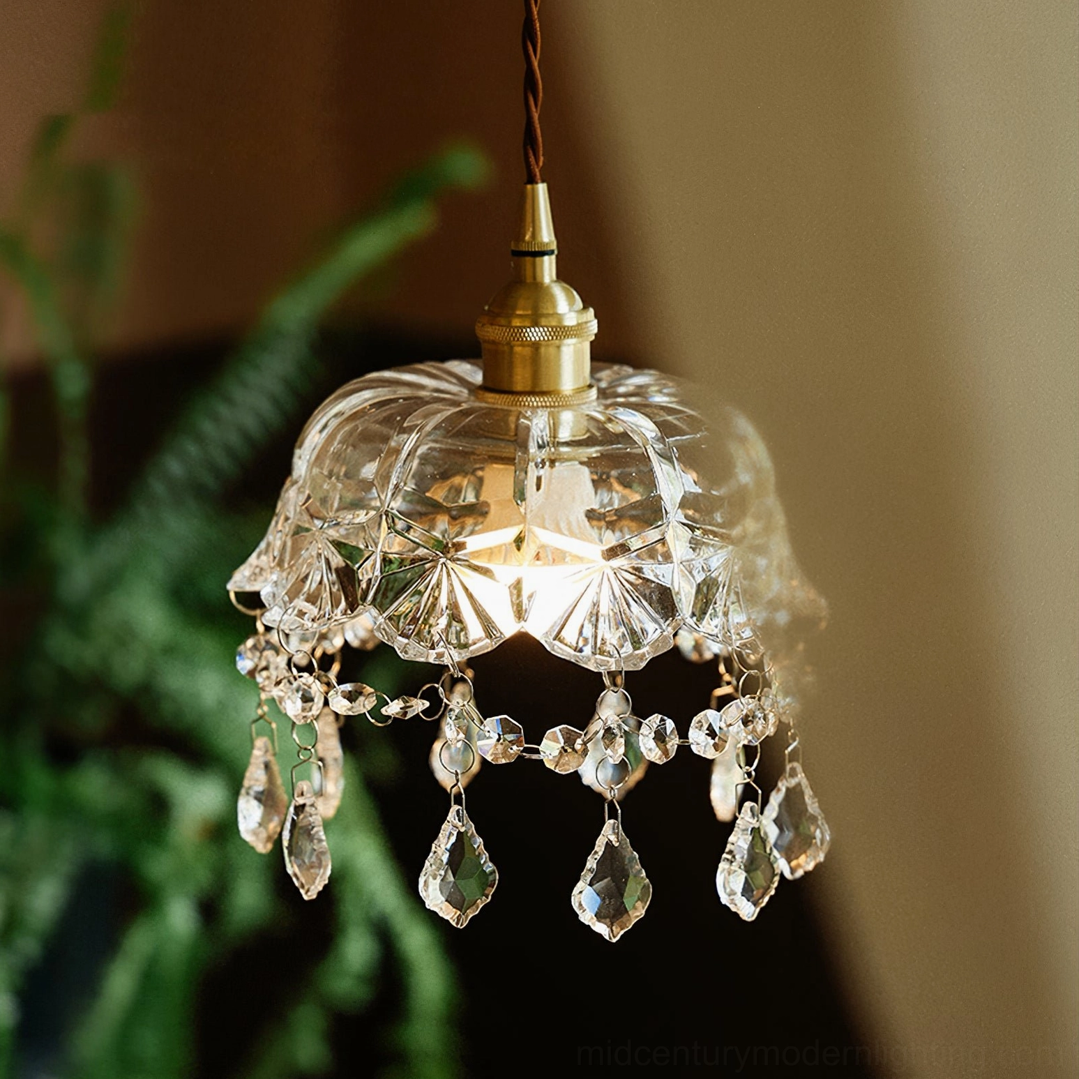 Mid-century modern crystal pendant light in natural greenery setting, romantic vintage style