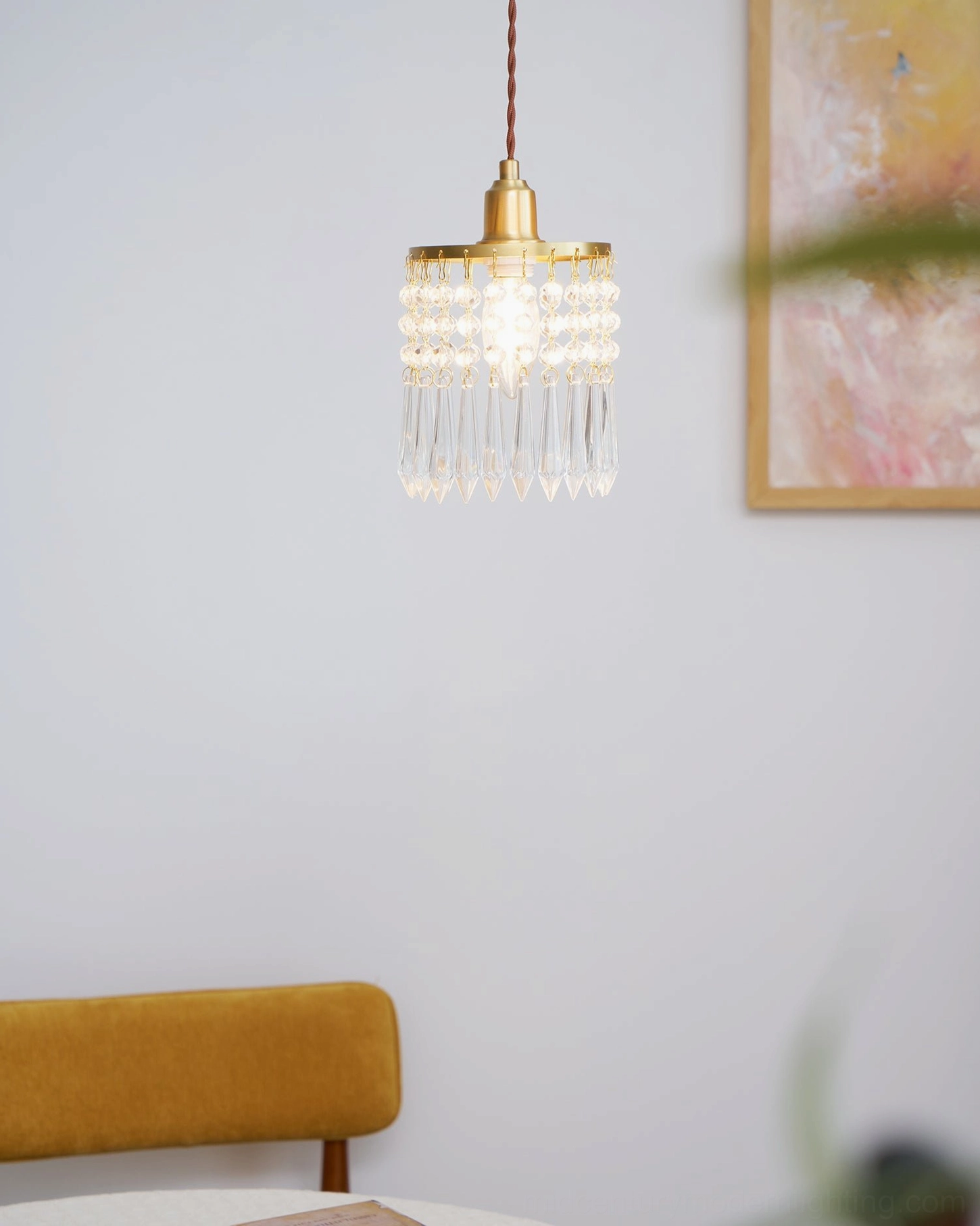 Crystal pendant light fixture overhead view, compact elegant proportions