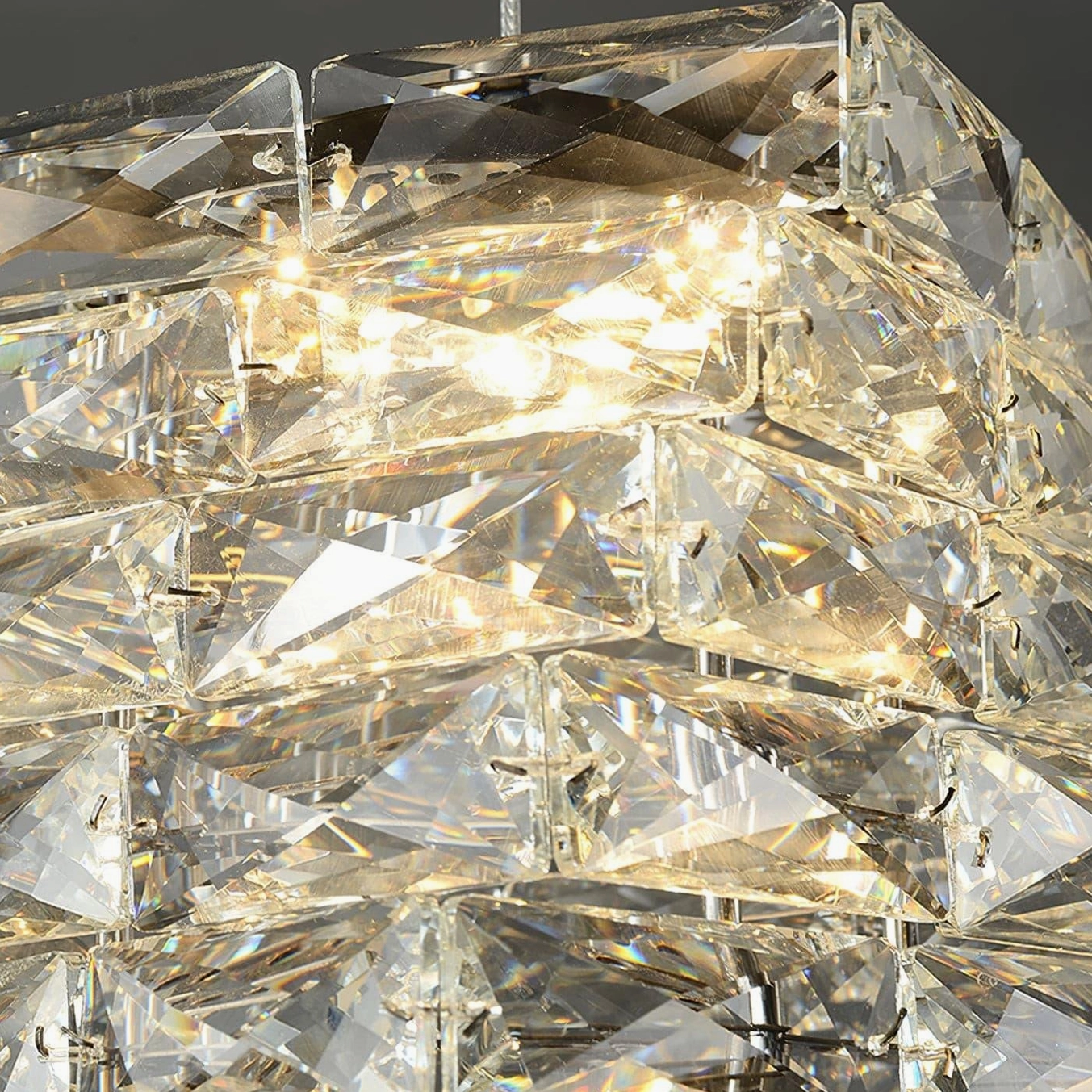 Crystal pendant lamp with warm glow showcasing faceted shade design in contemporary home setting