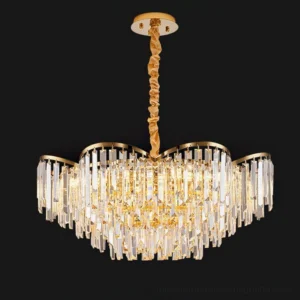 Round crystal chandelier with layered hanging prisms and gilded metal trim on black background
