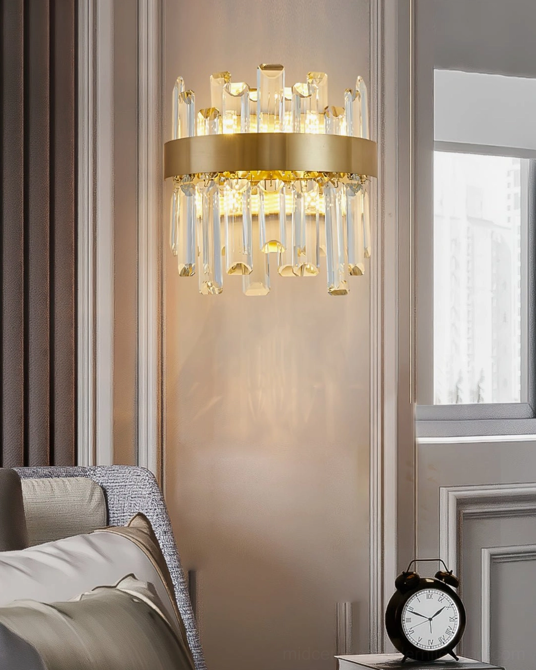 Crystal wall sconce in neutral bedroom nook with exterior window, creating intimate lighting beside bedside table and clock