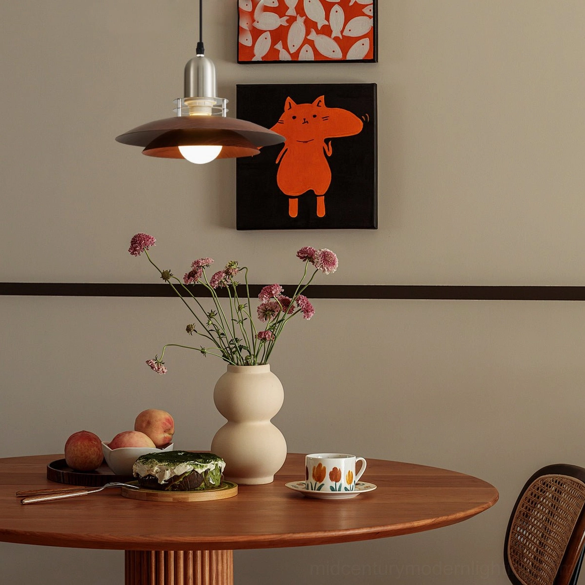 Cullen pendant light suspended in warm wooden dining nook, creating intimate ambient lighting over rustic dining table