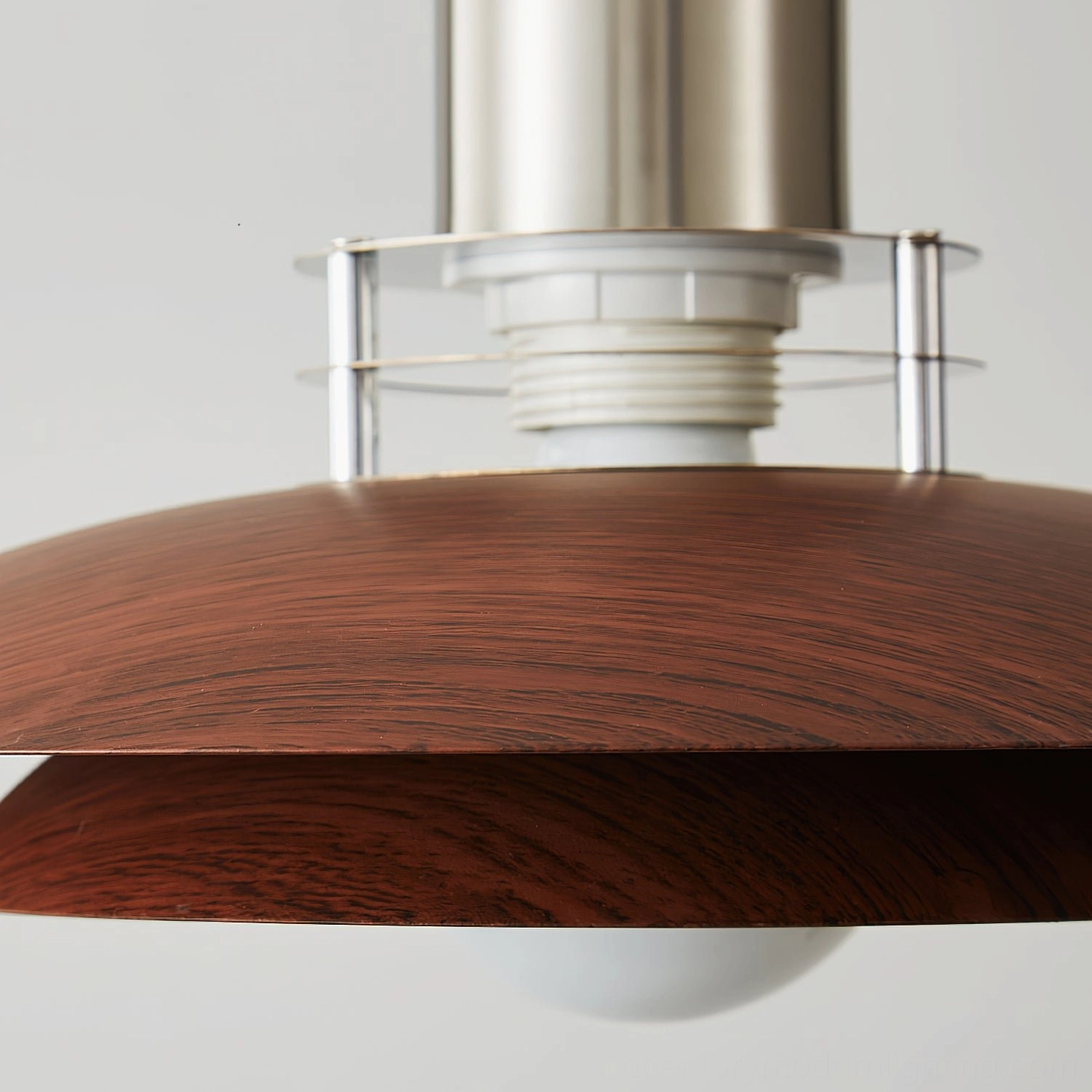 Cullen pendant light shade close-up, showing double-layer walnut wood-grain metal construction and detailing