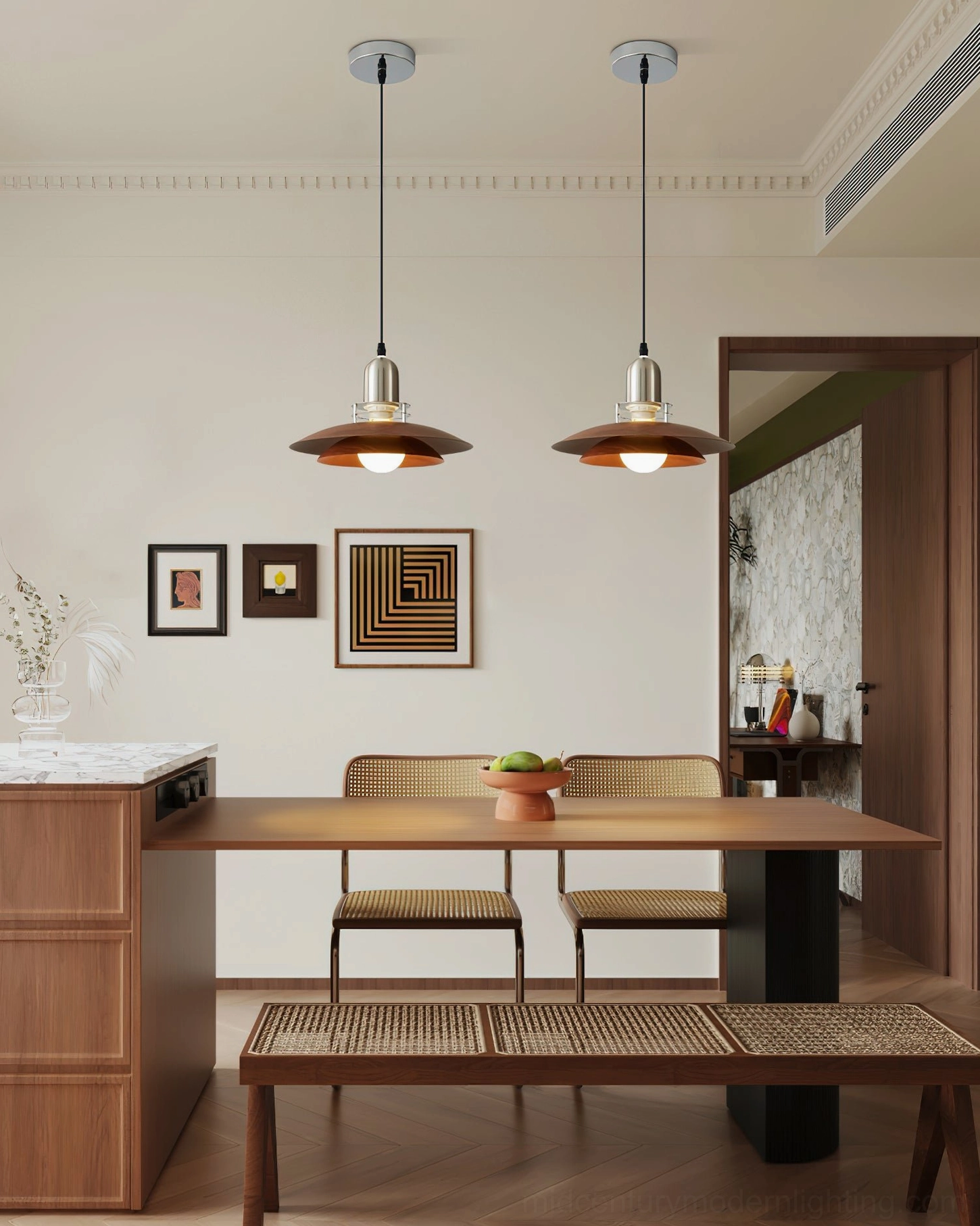 Pair of Cullen mid-century modern pendant lights hanging above contemporary dining room with long table setting
