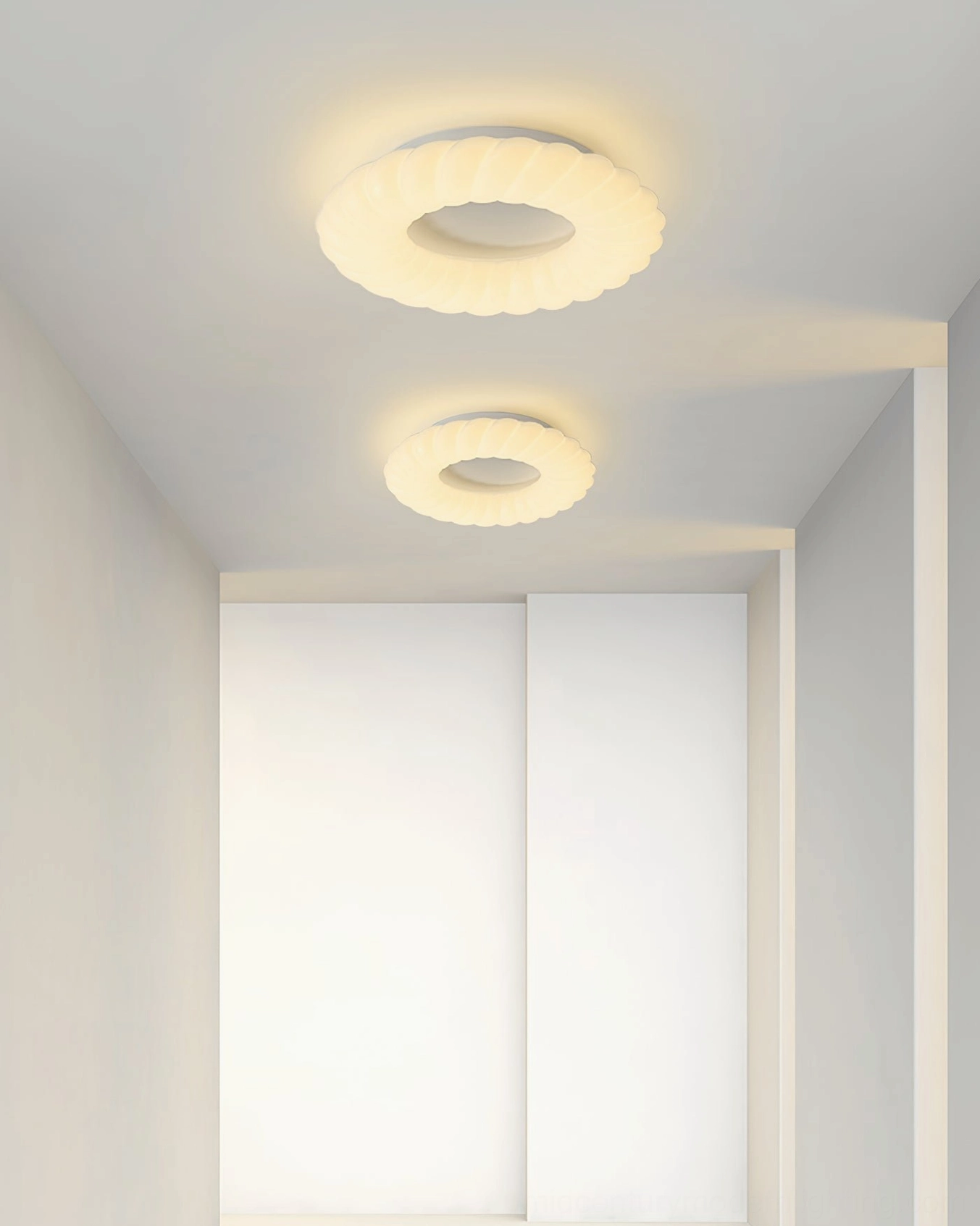 Twin Cumulus ceiling lamps in residential corridor creating rhythmic lighting pattern