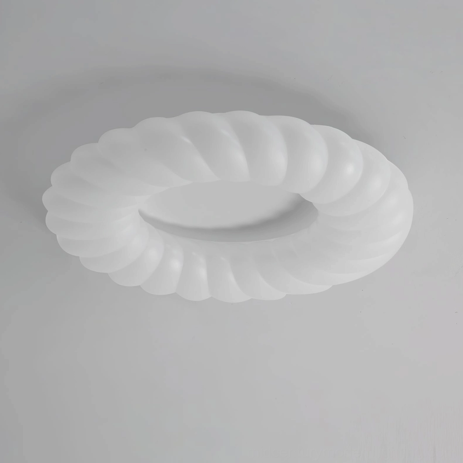 Cumulus ring ceiling light fixture detail showing white matte plastic finish and ridges