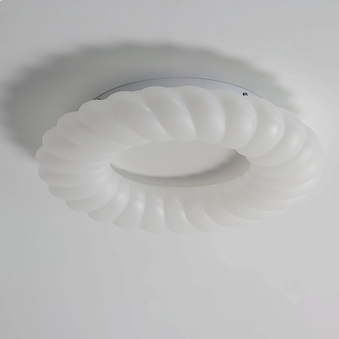 Cumulus LED ceiling fixture close-up side view showing detailed ridged circular silhouette
