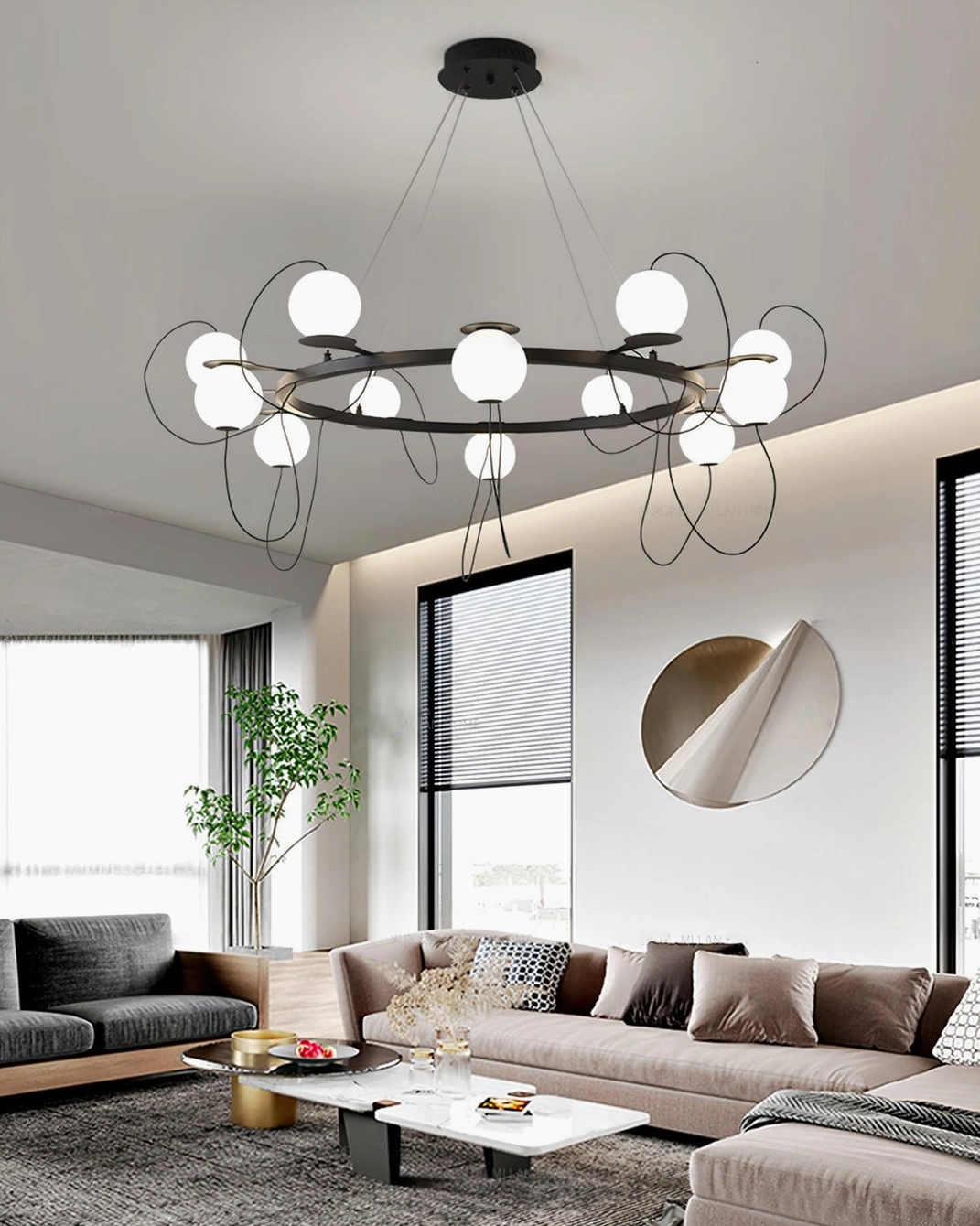 Curved-arm bubble chandelier casting warm ambient light in contemporary sectional living space