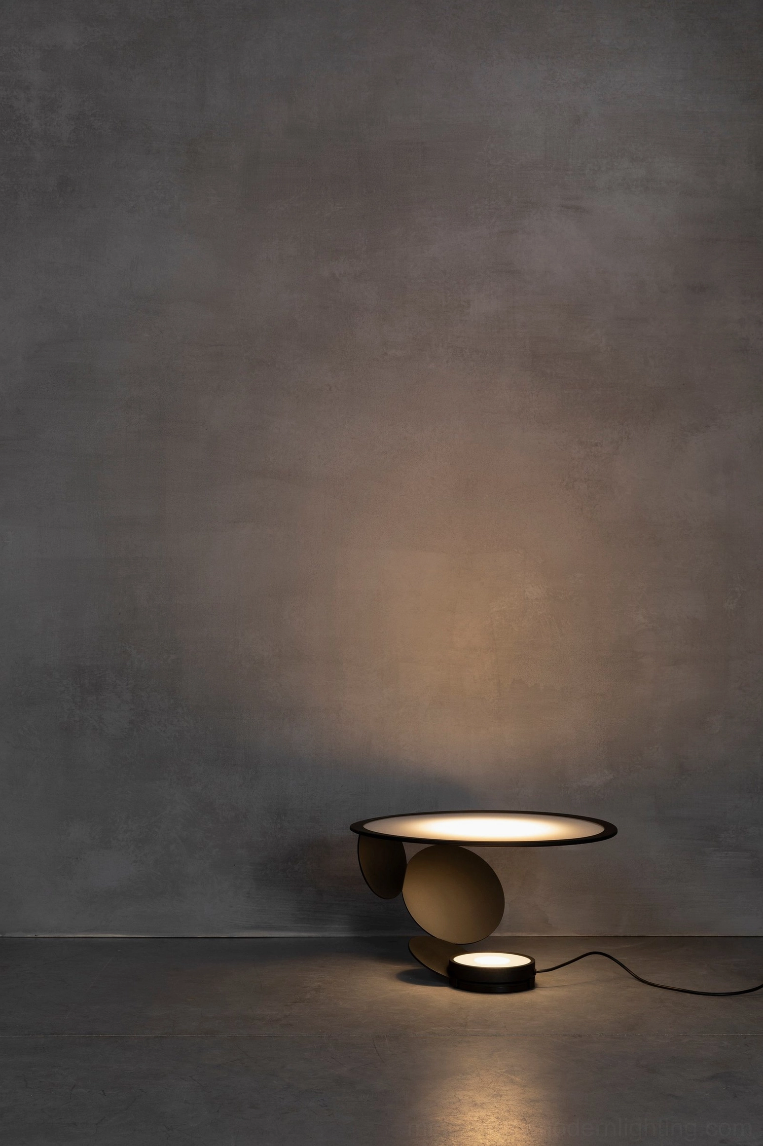 Contemporary Cut geometric table lamp styling in minimalist interior design setting with clean lines