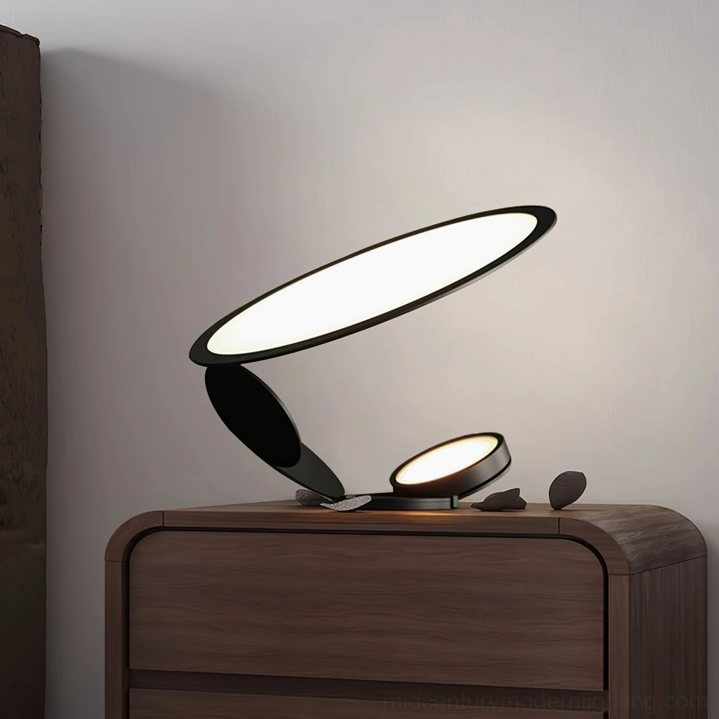Compact dual-head table lamp with oval light panels on bedroom wooden dresser with neutral home decor