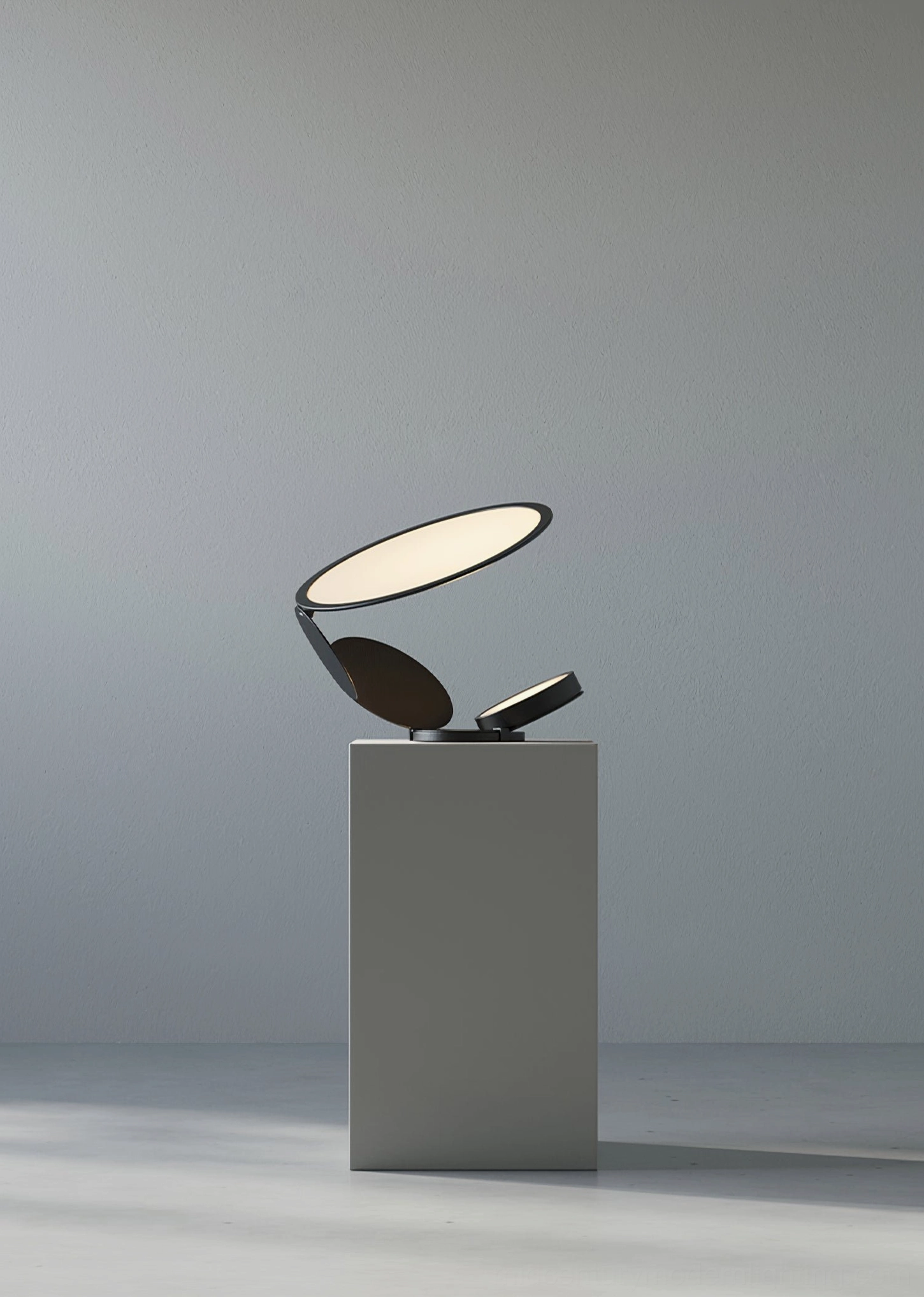 Modern Cut table lamp displaying matte black finish and dual adjustable light head positioning
