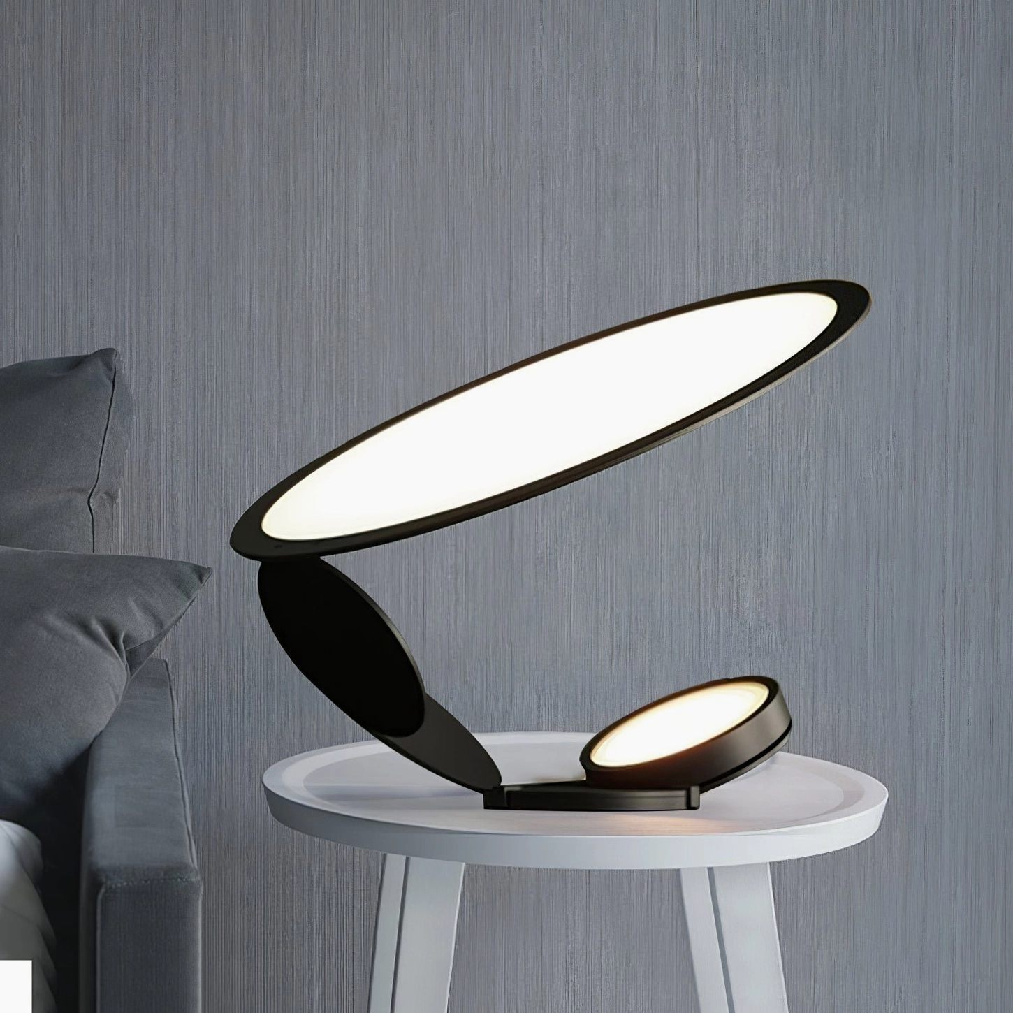 Contemporary geometric table lamp with bright neutral LED light on small white side table with grey sofa