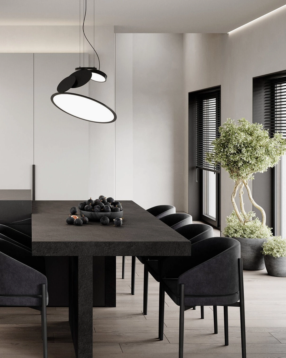 Cut pendant lamp installed above modern dining table dark interior setting