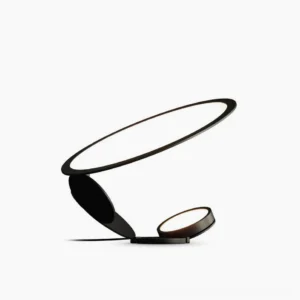 Cut modern table lamp with dual laser-cut geometric light diffusers in matte black finish, front studio view