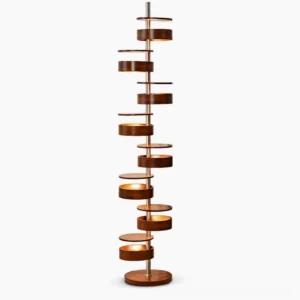 Cylindrical Flow floor lamp with stacked wood cylinders, walnut finish, studio view against white background, mid-century modern design