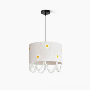 Daisy flower pendant lamp front view white linen shade yellow daisy embroidery pearl bead trim studio background
