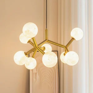 Lit Dallas Planet mid-century modern chandelier illuminating warm glow in contemporary home living space with wall art