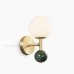 Dalt marble brass globe wall sconce with frosted glass shade and green marble sphere, front studio view