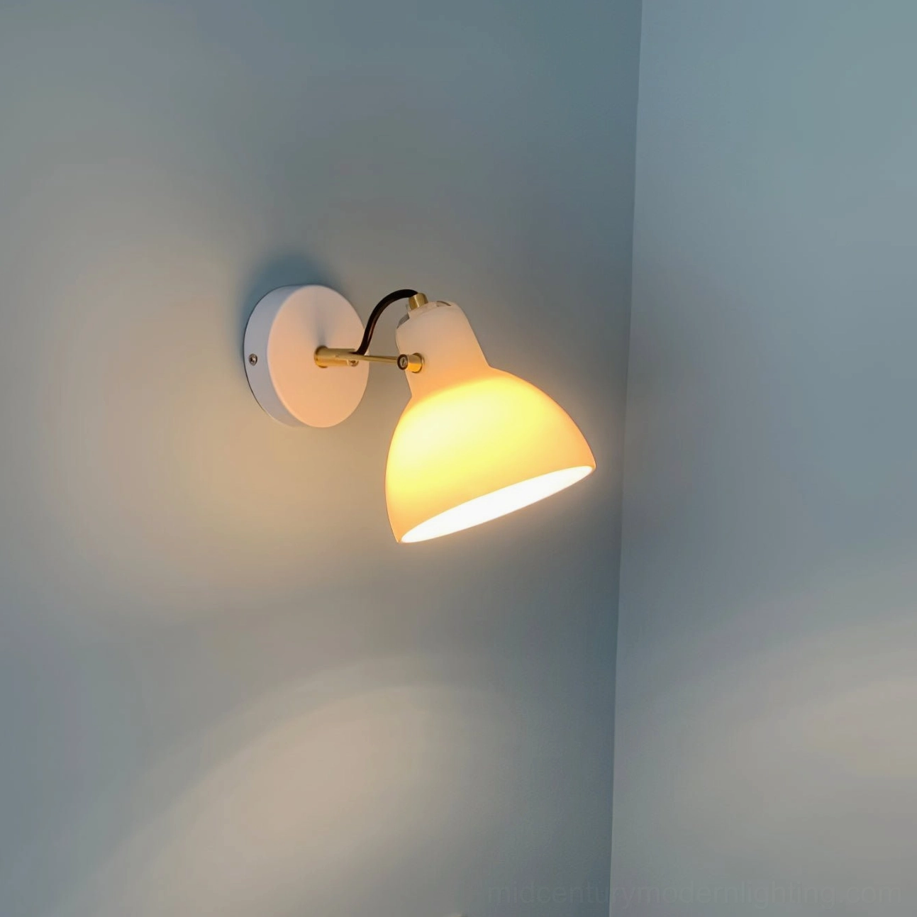 Articulated wall lamp with adjustable positioning for flexible ambient or task lighting applications