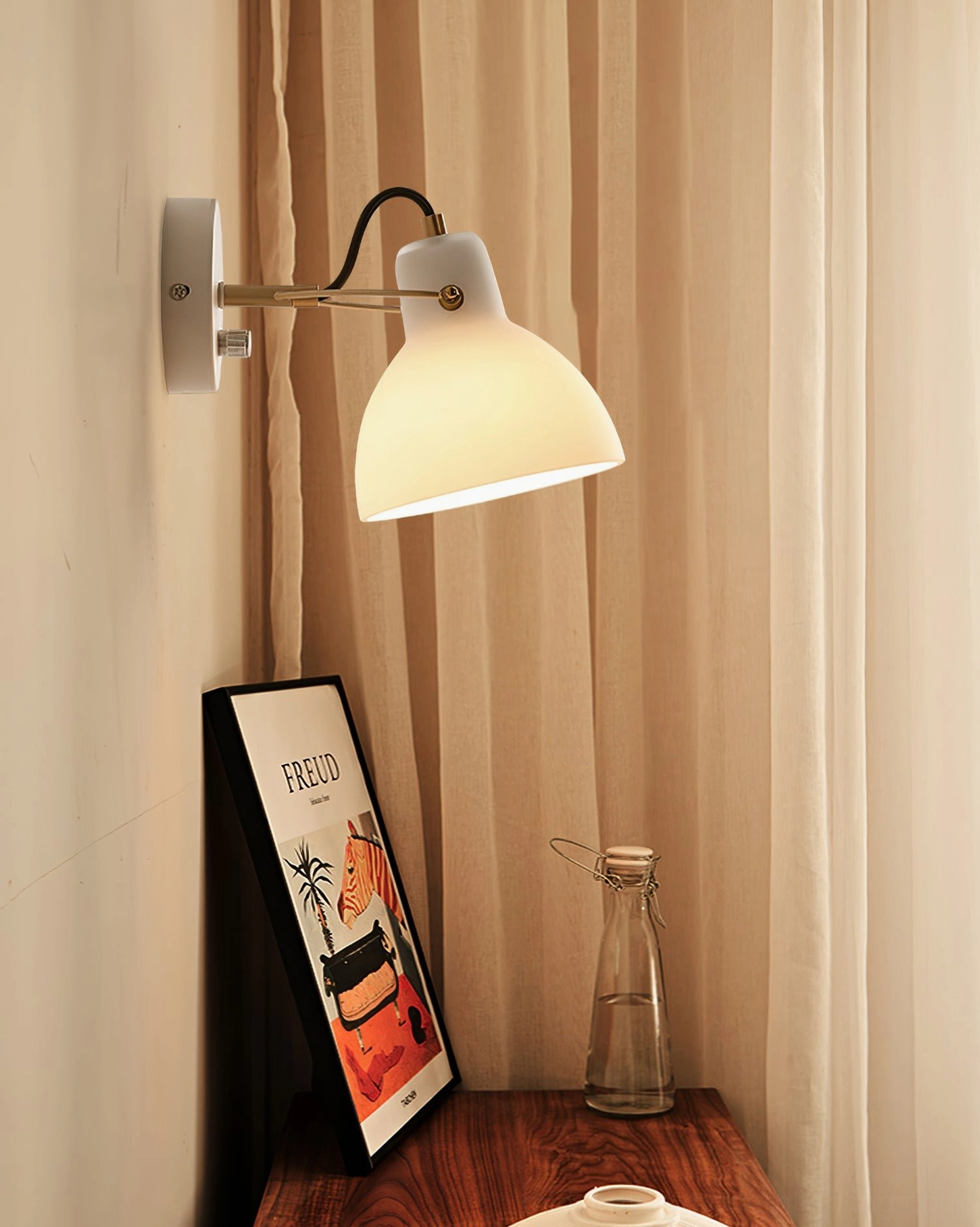 Bedside wall lamp mounted at eye-level in cozy bedroom interior with warm home decor styling