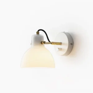 Daniel mid-century modern swing arm wall lamp with brass finish and frosted white glass shade on plain white background
