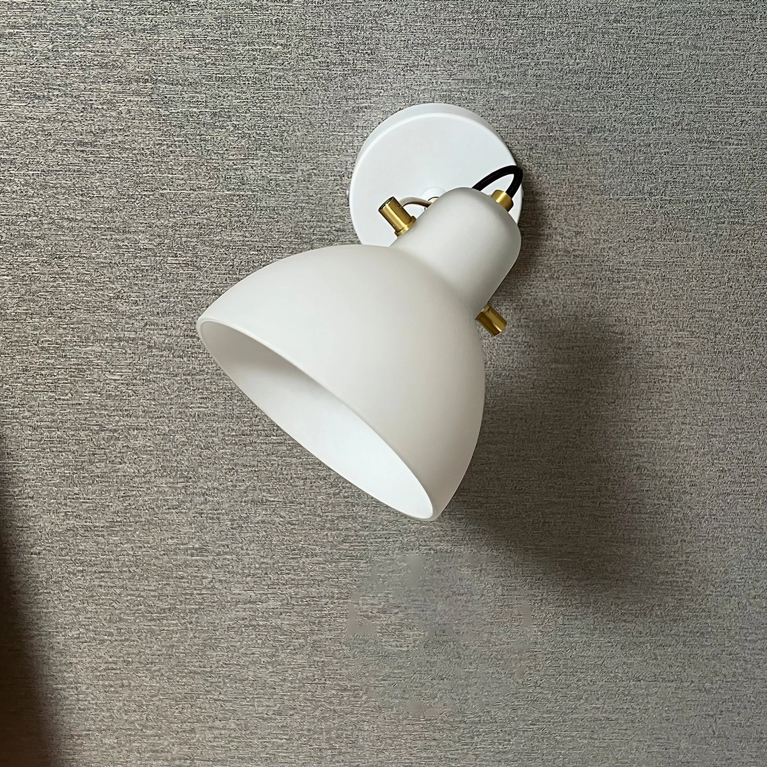 Wall-mounted reading lamp with E14 bulb compatibility and universal voltage, perfect for global homes
