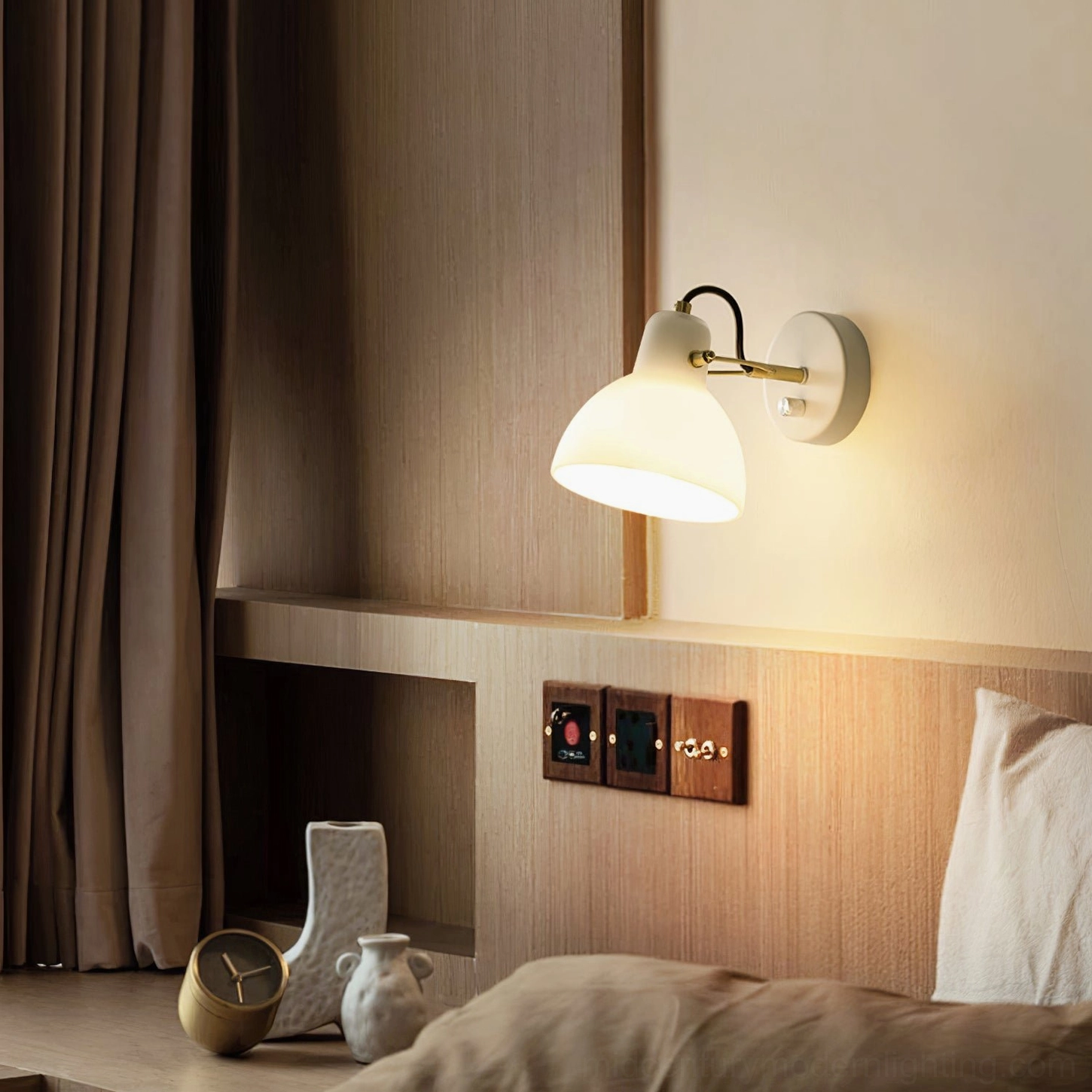 Contemporary adjustable wall lamp mounted in home office space, providing focused reading light