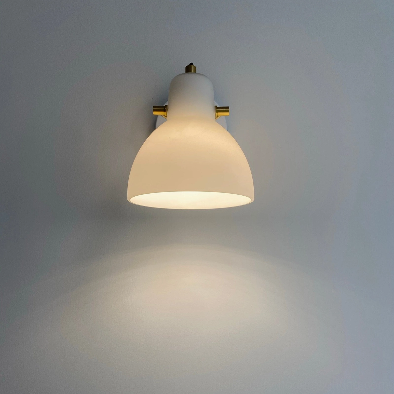 Daniel swing arm wall sconce in white and gold, showcasing mid-century modern aesthetic for residential spaces