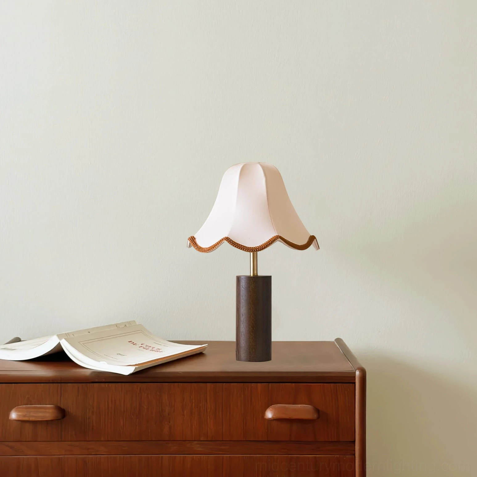 Danika mid-century table lamp three-quarter view on bedside table with open book, minimalist retro design