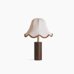 Danika mid-century modern table lamp with scalloped fabric shade and walnut wooden base, frontal studio view