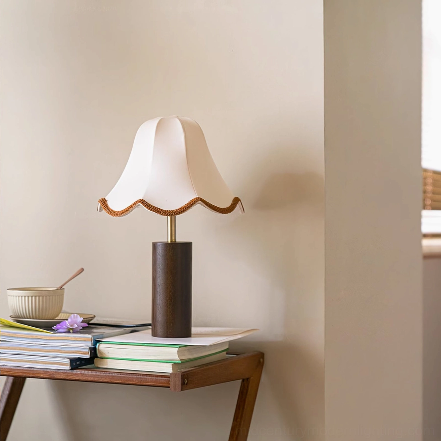 Danika table lamp styled on vintage side table with stacked books and ceramic bowl, retro cottage interior