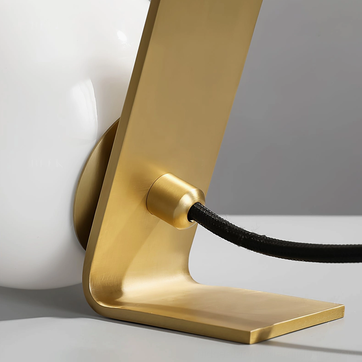 Daphne satin brass table lamp product photography, frosted white glass diffuser detail