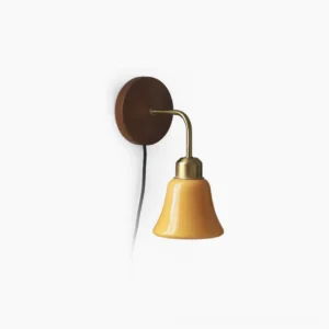 Daphne Pastel Plug-In Wall Sconce side profile showcasing warm orange glass shade, brushed brass gooseneck arm, and walnut wooden backplate against white background