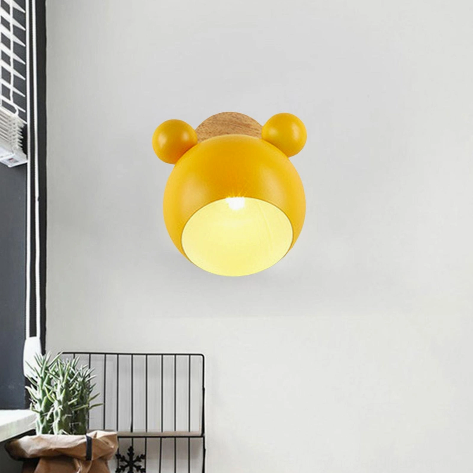 Dark gray mouse wall lamp in minimalist monochromatic interior design space