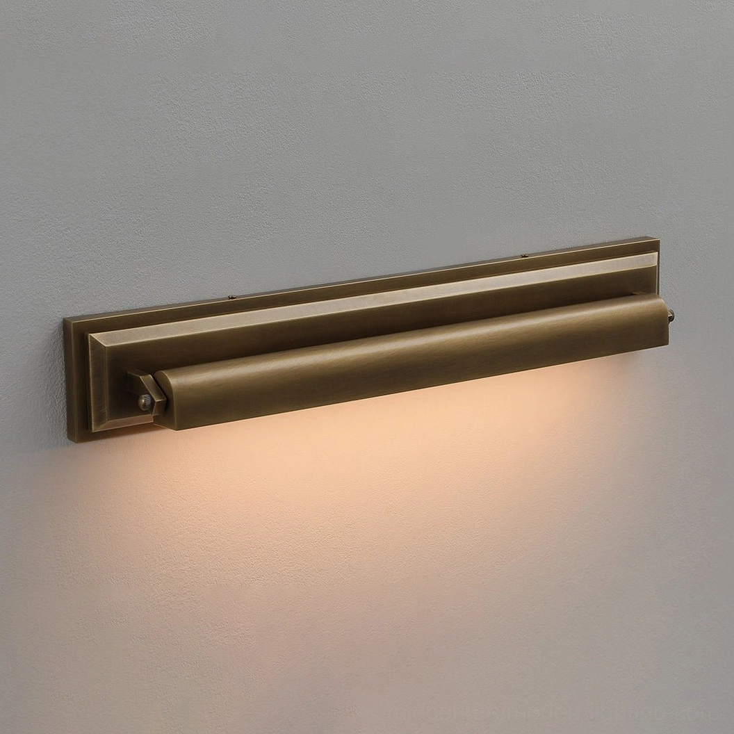 Close-up detail of Davenport tiered sconce unlit, showing antique bronze finish and layered metal construction